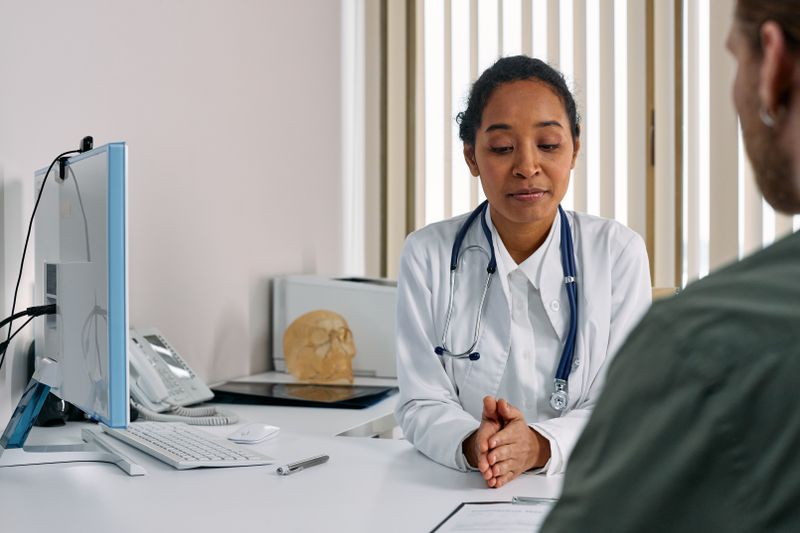 Doctor reviewing a patient's visit at Bright Path Clinic